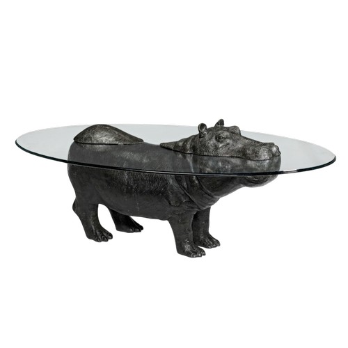 A "Mark Stoddart" Original Design, "The Hippo" coffee table, depicts a hippo standing strong and proud in the water, the tip of its head and back protruding above the water level. This 1 of Only 99 of these unique pieces were ever created. Measuring: 60 inches x 36 inches. (Glass Size).