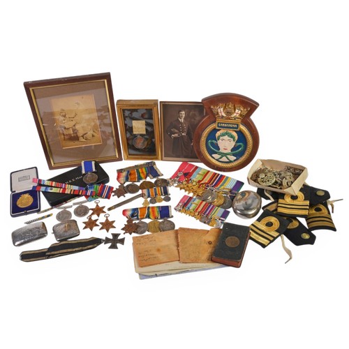 A Family Archive Collection of Mr. Edwin Lawrence (Born 18th July 1849) Chief Petty Officer Royal Navy who served on the Lord Napier's Expedition in Abyssinia in 1869, for the Arctic Expedition on H.M.S. Alert on the 22nd April 1875, the object was to penatrate the far North West passage of open sea & for a Geographical Survey, the H.M.S. discovery was left in winter quarters & the Alert pushed on Lat 82, Deg 27, Long 61 deg, 18 min close to Cape Sheridan in Grinnell Land. Mr. Lawrence was a Petty Officer 1st Class & was Captain of a Sledge of which there were two with ice boats with 19 men & went to the latitude 83 deg, 20 mins, 26 Sec's, North Long 63 deg & 5 mins. They had an arduous & dangerous march & covered half a mile in one day, they suffered from scurvy & frostbite, Mr. Lawrence marched on his toes for Forty days & passed away on the 21st September 1930 at the age of 81. He had three sons & three Daughters along with the Collection are, Medals, a Sword, Belts, Coats, Original Letters relating to the above. The Collection consists of the Victorian "Nares Expedition 1875-1876" Silver Medal in Case with Ribbon inscribed Edwin Lawrence POIC H.M.S. Alert & one other Medal inscribed E. Lawrence CHF Captain of Fore Castle H.M.S. Excellent Medal with Ribbon, a Silver Squeeze Action Tobacco Box hallmarked & marked "E.A.L. from Ces, 18th December '06", a matching Silver Vesta Case with engine turn decoration, a Cheroot Silver Case both engraved E.A.L. a Book of Common Prayer with inscription that it was taken to the Arctic Region, a Photograph of E.A. Lawrence in Artic Costume, a letter of the Official report of Captain Nares to the Admiralty on Lawrences conduct signed by the Captain of H.M.S. Vernon along with the Collection are the Naval Medals for "J. A. Lawrence RN WT.V.O.E.. Naval Medal, Three WWI Medals & Miniatures, A.B. Lawrence Cera 1265 C. E. R. A. 1H. M.S. Fisgard & three WWI medals, the medals of "R. E. Lawrence" to include Malay Peninsula, Korea, Defence, Burma, Africa, Atlantic with Bar, France & Germany, 39-45 & a Chromium plated O.B.E. with a similar case, Two Unnamed Defence & Three Stars along with Captain's Epaulettes, a 1938 Fencing Medal, German Iron Cross, Cap Badges, a Firmin & Sons of 8, Cork Street, London Shagreen mounted Naval Sword with Pommel in Sheath with Carry Case, a Naval Blazer with Trousers, Long Coat, Belt & Sash.