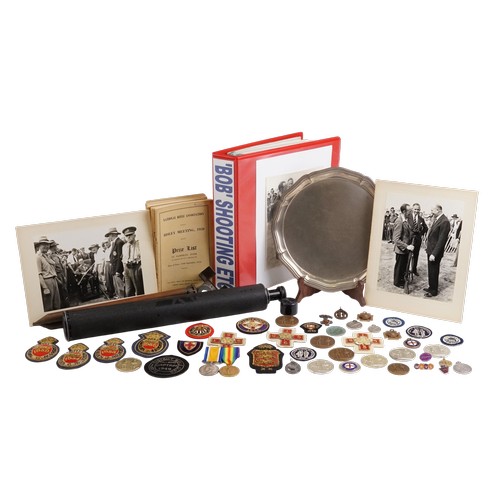 "Lesley Robert Fenwick" Born 1914, Collection of National Rifle Association Medals to include a Silver Salver (Weighing 523 grams) given to him by the people of Fleet for the Queen's Prize at Bisley with a record score of 286/300 achieved with a Lee Enfield with Iron Sites included in the lot are Rifle Club Captain's Badges, Bisley insignia for 1954 & 1955, Silvered Medals, Maltese Cross, Rifle Club Badges, Lapel Cloth Badges, Prize List & a Folder with detailed list of Awards & Photographs, a Spotter's Scope, Tripod, Two WWI medals awarded to "04404 A. Corporal R. H. Fenwick A.O.C.". A lovely lot that needs viewing.
