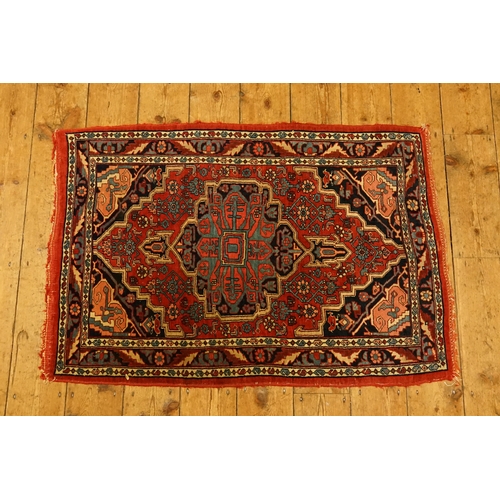 A small hand knotted Persian wool rug, probably North West Persian ...