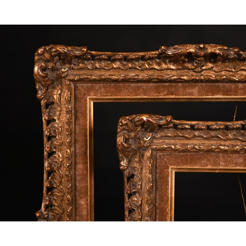 606 - 20th Century English school. A Gilt Composition frame with swept and pierced centres and corners wit... 