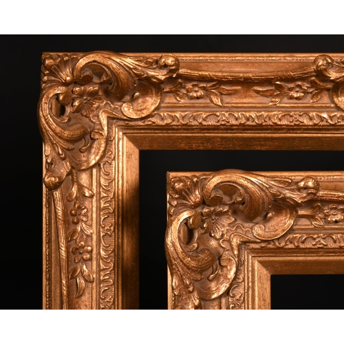 608 - 20th Century English school. A Gilt Composition frame with swept and pierced centres and corners, re... 