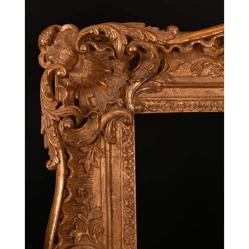 609 - 20th Century English School. A Carved Giltwood Frame, with swept and pierced centres and corners, re... 