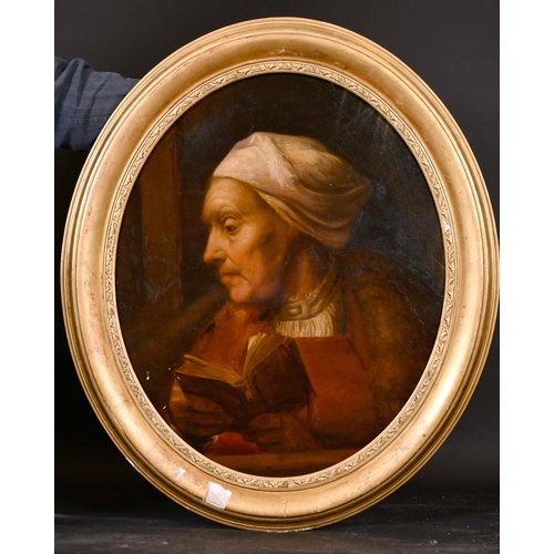 92 - 19th Century Dutch School. A Portrait of an Old Lady reading a Book, Oil on Canvas, Oval, 25” x 21” ... 