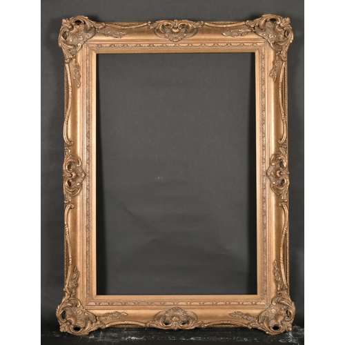 447 - 20th Century English School. A Gilt Composition Frame, with swept and pierced centres and corners, r... 