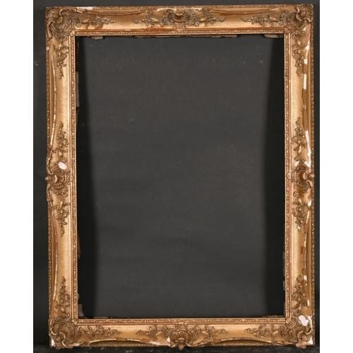 501 - 19th Century English School. A Gilt Composition Frame, with swept centres and corners, rebate 23” x ... 