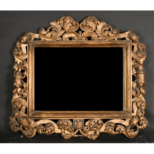 539 - 18th Century European School. A Carved Giltwood Baroque Frame, with a Heraldic Plaque, and inset mir... 