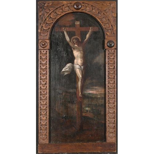 58 - 17th Century European School. Christ on the Cross, Oil on Panel, in a carved wood Frame, Arched 17.7... 