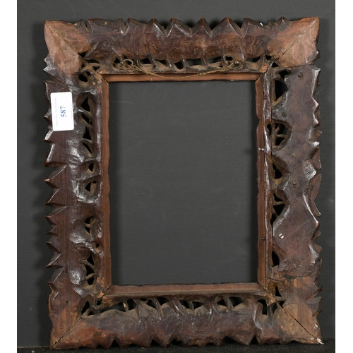 587 - 19th Century German School. A Carved Darkwood Leaf Design Frame, rebate 8.5” x 6.25” (21.7 x 15.8cm)