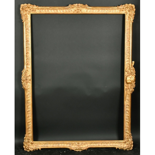 410 - Late 20th Century European School. A Carved Giltwood Swept Frame with central motif (horizontal), re... 