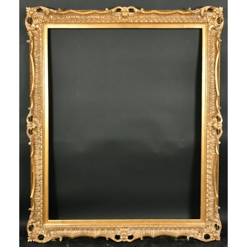 413 - 20th Century English School. A Reproduction Carved Giltwood Frame, with swept and pierced centres an... 