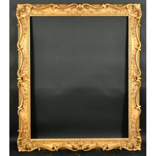 414 - Alexander G Ley & Son.  A Reproduction Carved Giltwood Frame, with swept and pierced centres and cor... 