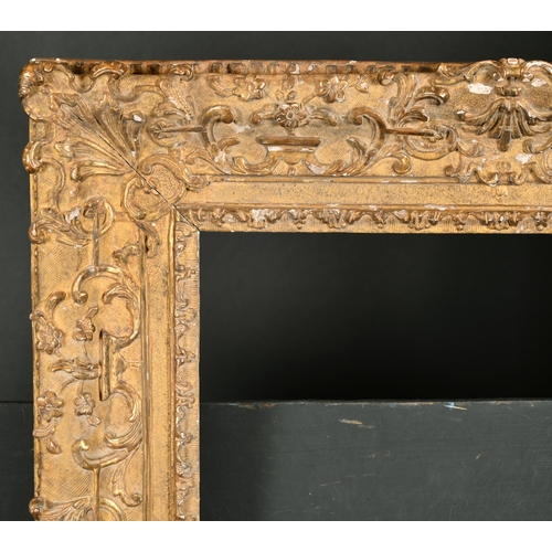 511 - 18th Century French School. A Regence Carved Giltwood Frame, with swept centres and corners, rebate ... 