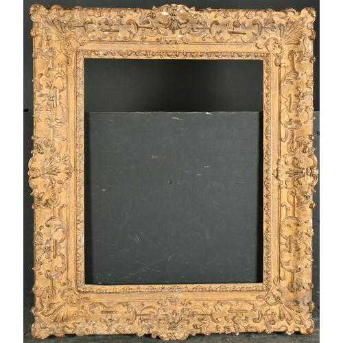 511 - 18th Century French School. A Regence Carved Giltwood Frame, with swept centres and corners, rebate ... 