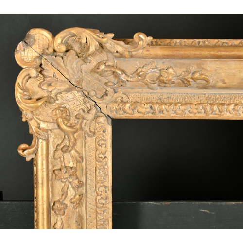 514 - Early 18th Century French School. A Louis XIV Carved Giltwood Frame, with swept corners, rebate 19