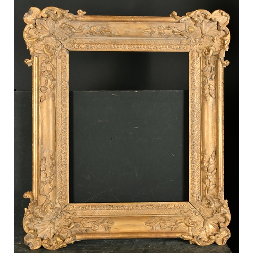 514 - Early 18th Century French School. A Louis XIV Carved Giltwood Frame, with swept corners, rebate 19