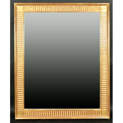 530 - Alexander G Ley & Son. A Reproduction Neoclassical Fluted Mirror, Overall 52.75