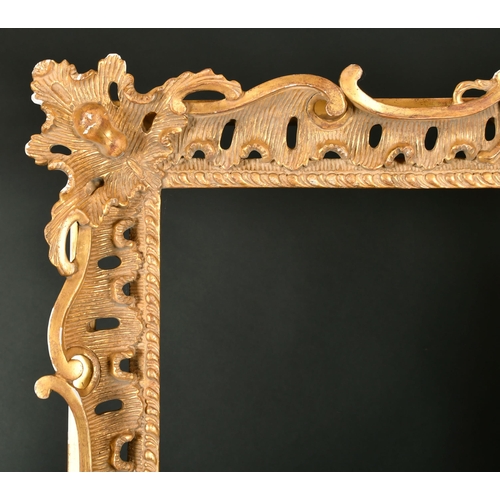 462 - 20th Century English School. A Carved Giltwood Frame, with swept and pierced centres and corners, re... 