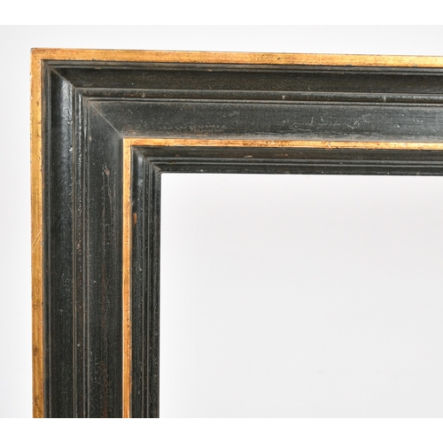 277 - John Davies Framing. A Reproduction Dutch Black Frame, with gold inner and outer edging, rebate 58.7... 