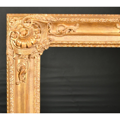 294 - John Davies Framing. A Reproduction Carved Giltwood Louis XIV Style Frame, with swept centres and co... 