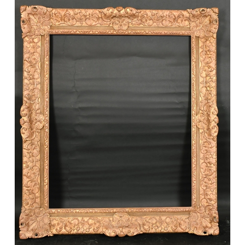 305 - John Davies Framing. A Reproduction Carved Giltwood Louis XIV Style Frame, with swept centres and co... 