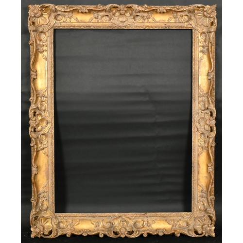 313 - John Davies Framing. A Reproduction Carved Giltwood Louis XIV Style Frame, with swept and pierced ce... 