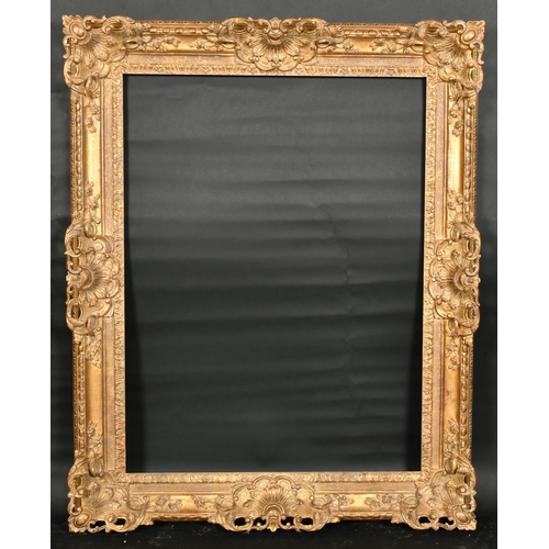 314 - John Davies Framing. A Reproduction Carved Giltwood Louis XIV Style Frame, with swept and pierced ce... 