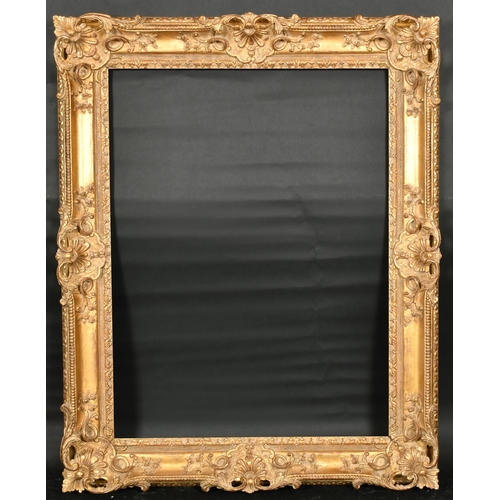 315 - John Davies Framing. A Reproduction Carved Giltwood Louis XIV Style Frame, with swept and pierced ce... 