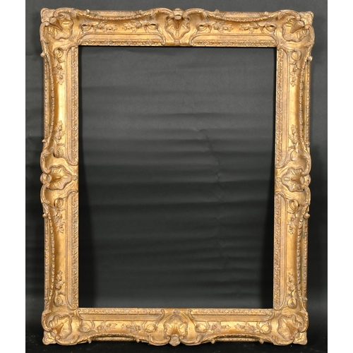 317 - John Davies Framing. A Reproduction Carved Giltwood Louis XIV Style Frame, with swept centres and co... 