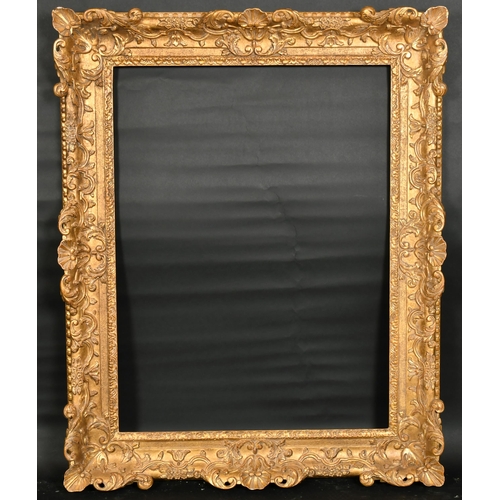 319 - John Davies Framing. A Reproduction Carved Giltwood Louis XIV Style Frame, with swept and pierced ce... 