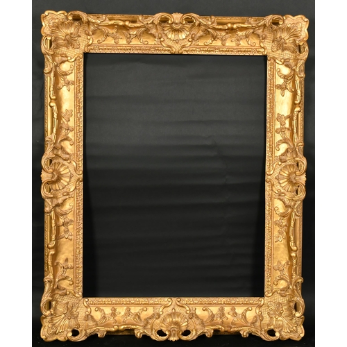 321 - John Davies Framing. A Reproduction Carved Giltwood Louis XV Style Frame, with swept and pierced cen... 