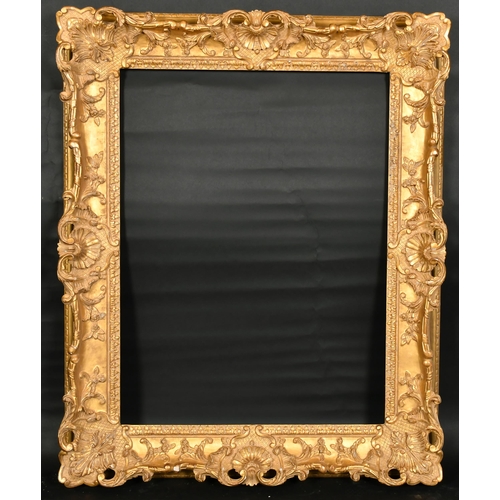 323 - John Davies Framing. A Reproduction Carved Giltwood Louis XV Style Frame, with swept and pierced cen... 