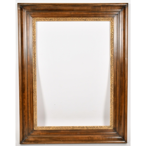 330 - John Davies Framing. A Reproduction Darkwood Two Part Teniers Frame with a Carved Giltwood inner edg... 