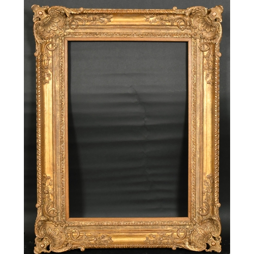 343 - John Davies Framing. A Reproduction Carved Giltwood Louis XIV Style Frame, with swept and pierced co... 