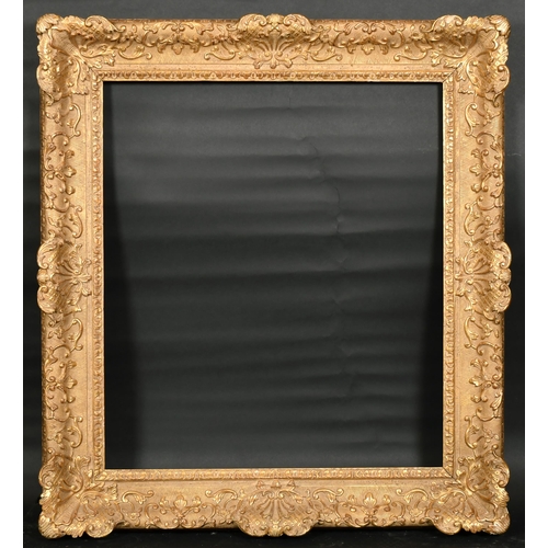 354 - John Davies Framing. A Reproduction Carved Giltwood Louis XIV Style Frame, with swept centres and co... 