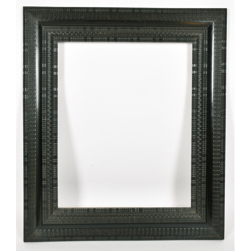 359 - John Davies Framing. A Reproduction Darkwood Reverse Ripple Frame, rebate 25.5