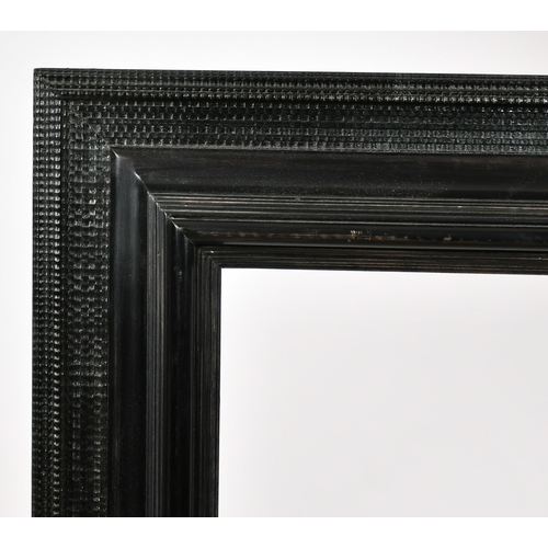 367 - John Davies Framing. A Reproduction Darkwood Reverse Ripple Frame, rebate 24.75