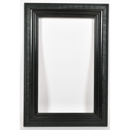 367 - John Davies Framing. A Reproduction Darkwood Reverse Ripple Frame, rebate 24.75