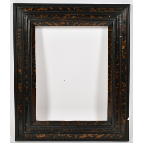 407 - 20th Century English School. A Darkwood and Simulated Tortoiseshell Combination Profile Frame, rebat... 