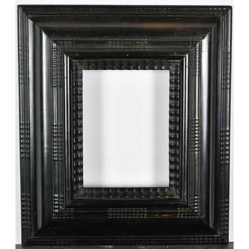 419 - John Davies Framing. A Reproduction Darkwood Reverse Ripple Frame, rebate 7.75