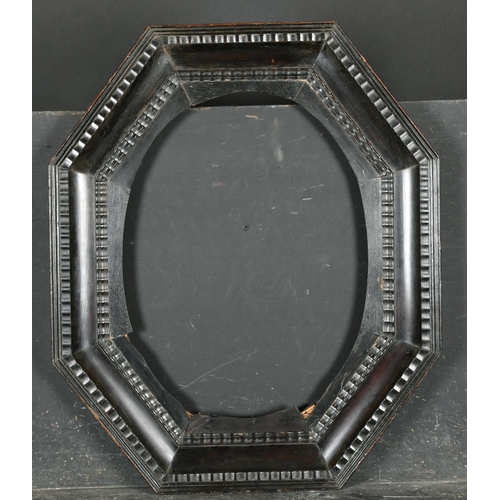 410 - 18th Century Dutch School. An Octagonal Shaped Dutch Black Frame, with an oval insert, rebate 16.75