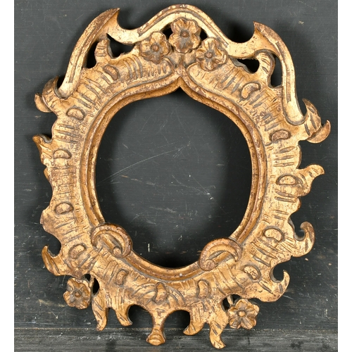 445 - 18th Century Italian School. A Carved Giltwood Frame, shaped, rebate 6.5