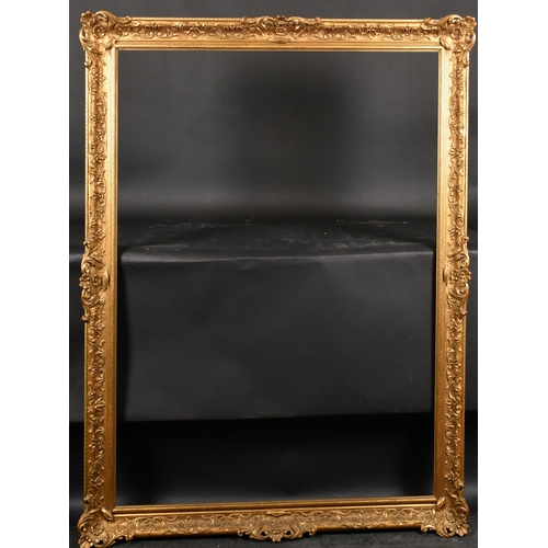 296 - 20th Century English School. A Gilt Composition Frame, with swept and pierced centres and corners, r... 