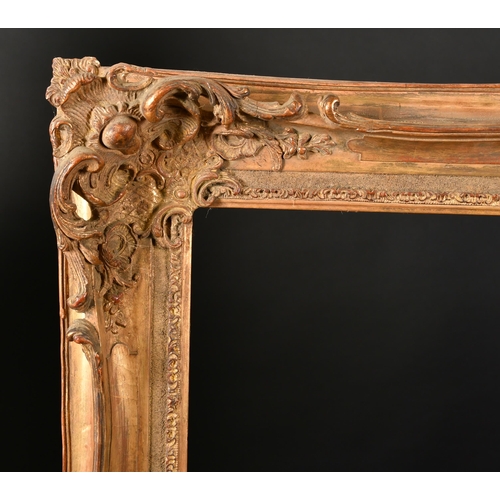 298 - 20th Century European School. A Gilt Composition Frame, with swept and pierced centres and corners, ... 