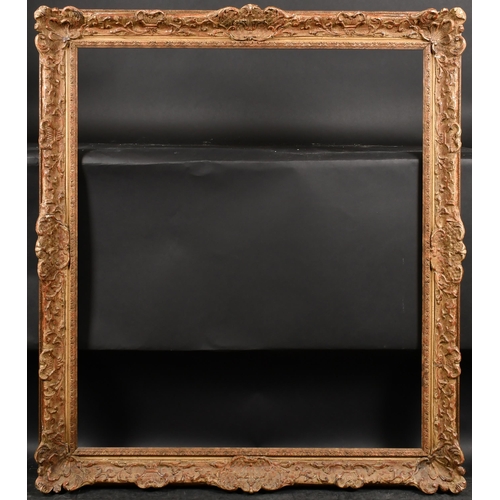 318 - 20th Century English School. A Gilt Composition Frame, with swept centres and corners and a fabric s... 