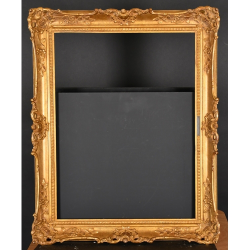 383 - 20th Century English School. A Gilt Composition Frame, with swept and pierced centres and corners, r... 