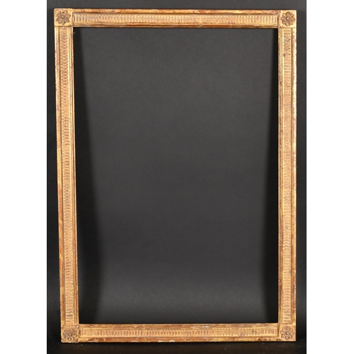 394 - 20th Century French School. A Louis Style Giltwood Frame, with flutes and paterae corners, rebate 23... 