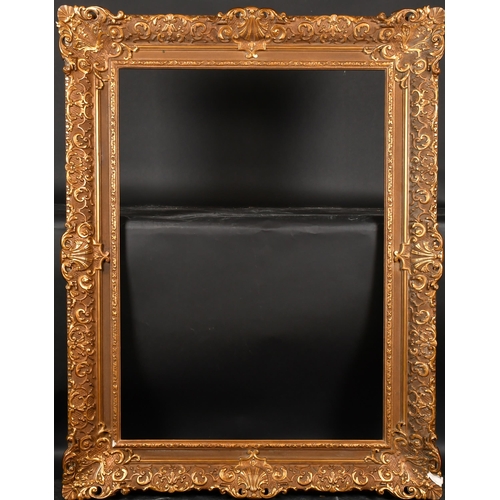 203 - 20th Century European School. A Gilt Composition Frame, with swept centres and corners, rebate 42