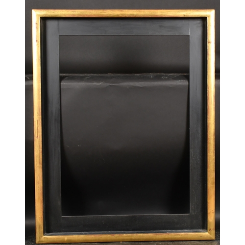 218 - Alexander G Ley & Son. A Gilt Composition Frame, with a black slip, rebate 34.5