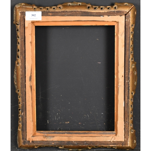 302 - 20th Century English School. A Gilt Composition Frame, with swept and pierced centres and corners, a... 